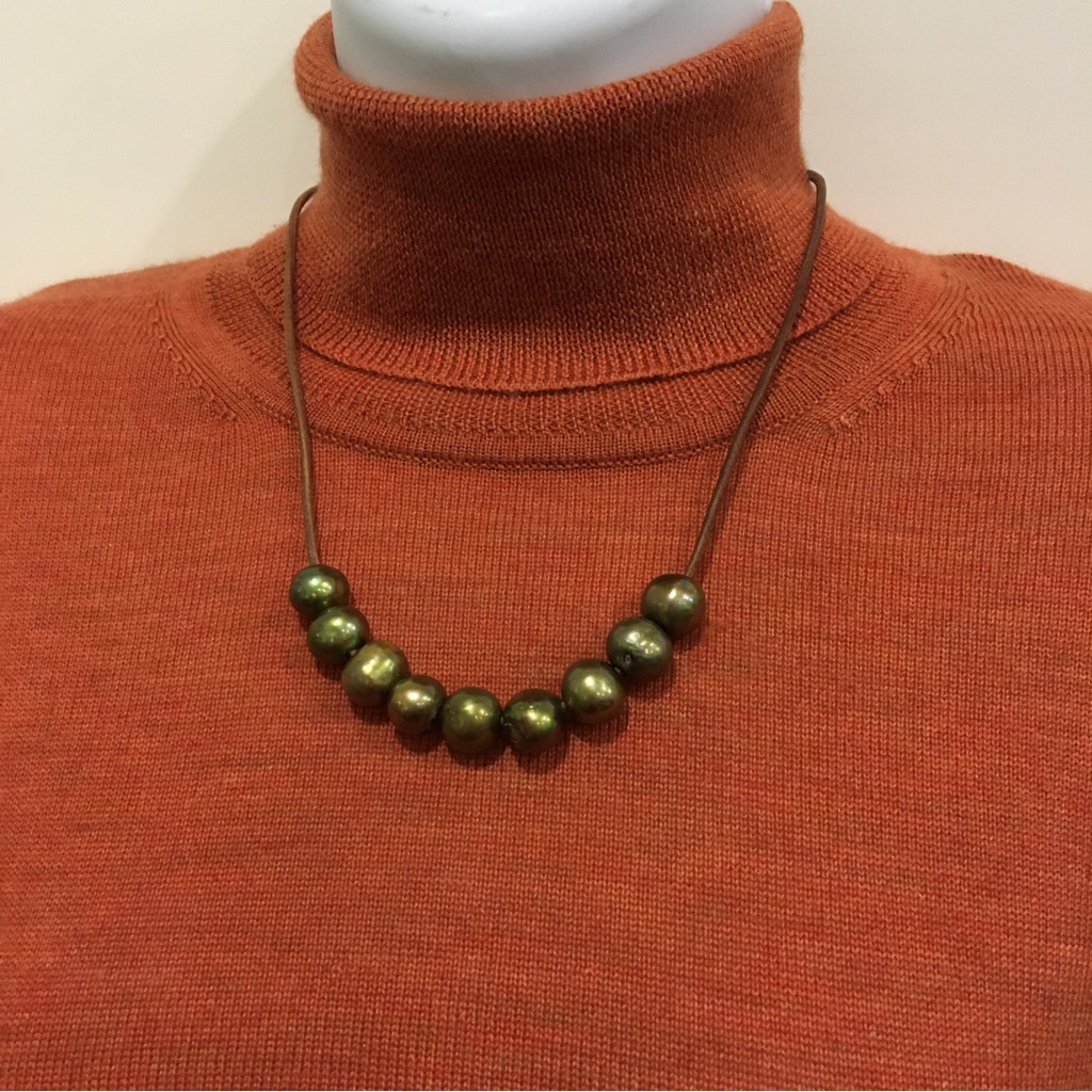 Nine Brass Colored Beads On A Narrow Leather Unusual Necklace 12$
